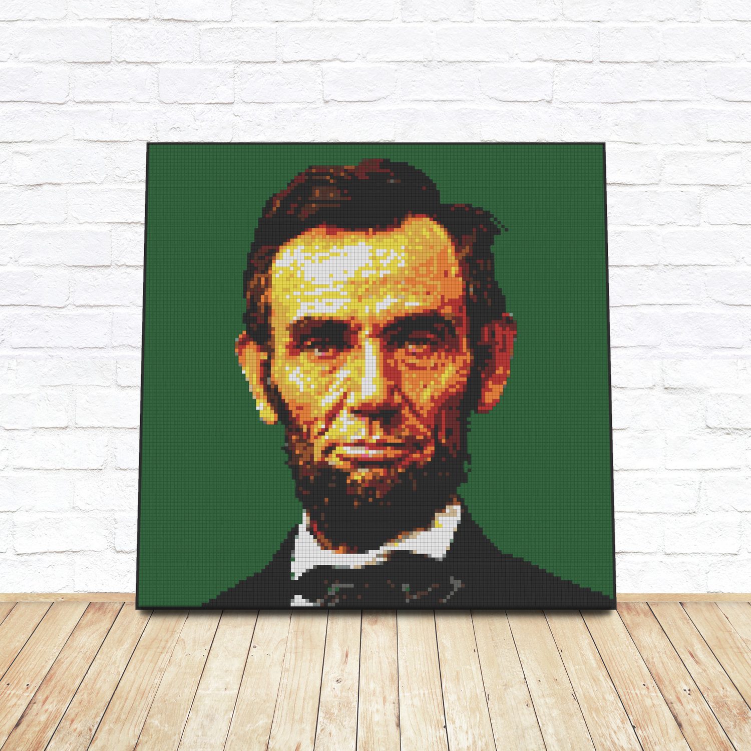 Framed LEGO tile pop-art portrait of Abraham Lincoln leaning against a white brick wall