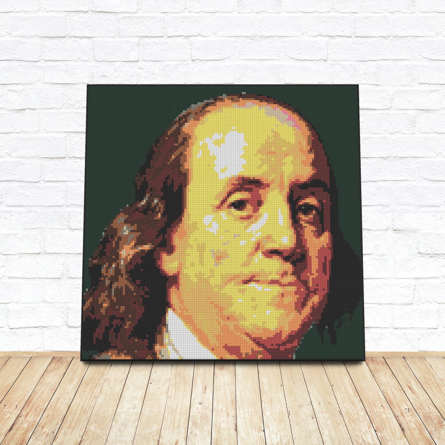 Framed LEGO tile pop-art portrait of Benjamin Franklin leaning against a white brick wall